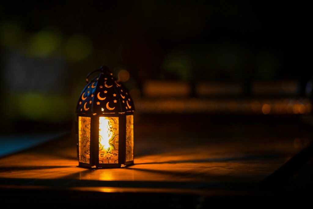 pexels photo 2233416 2233416 A glowing lantern with crescent motifs creates a warm ambiance for Ramadan or Eid.